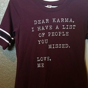 Maroon shirt w/ phrase in the front